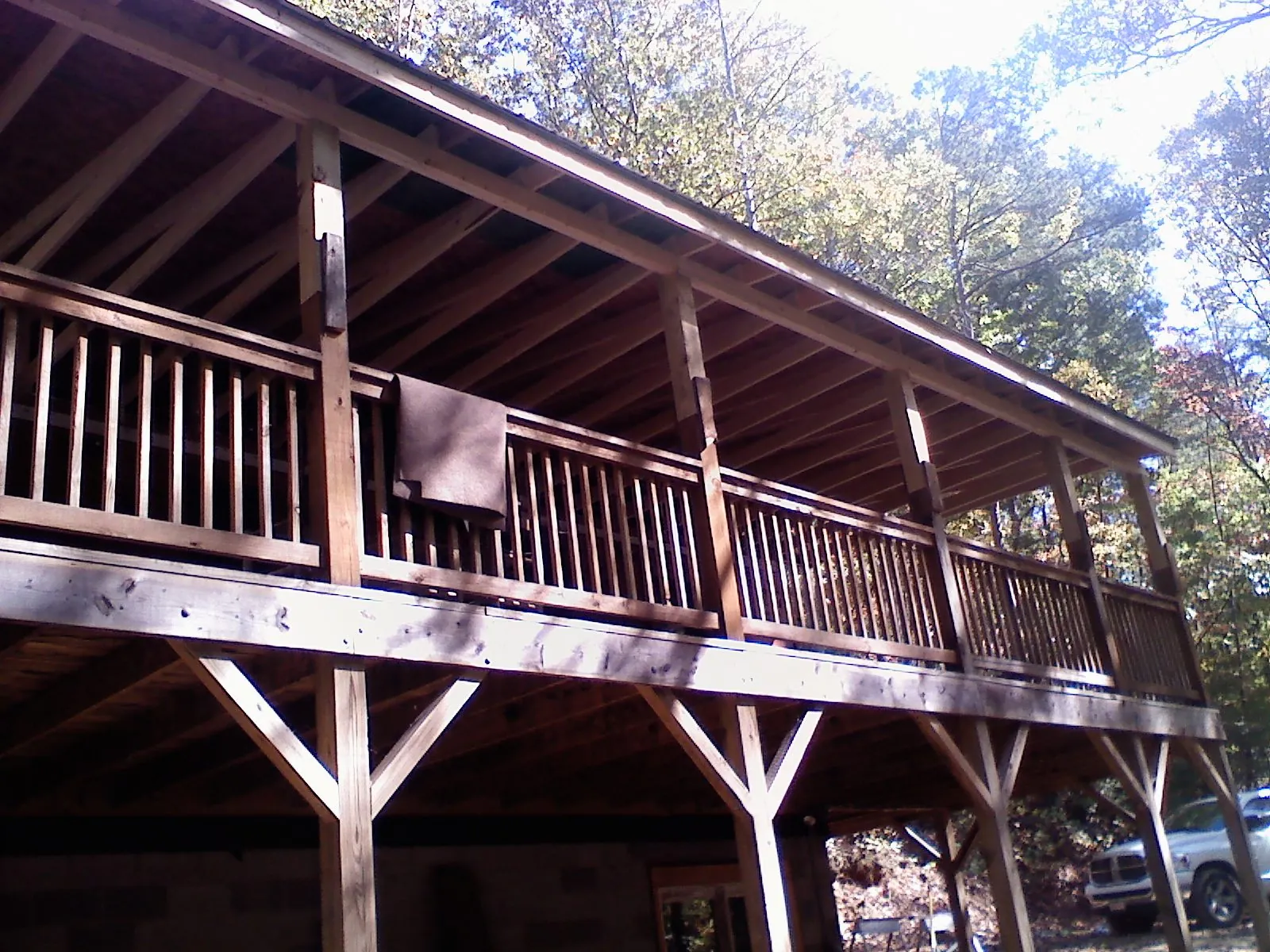 Timber framing under a new elevated porch and deck — Roof Leak Repair in East China by Roofing Brothers